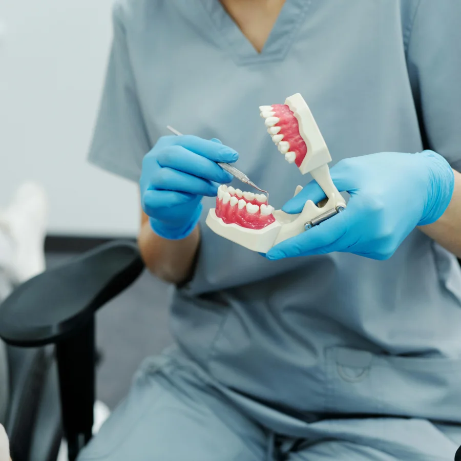 Gloved professional in a medical environment